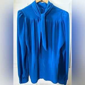 Vintage long sleeve blouse with button & pleating detail and a unique collar.